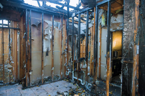 Professional Fire Damage Restoration technician working in Medford, NY